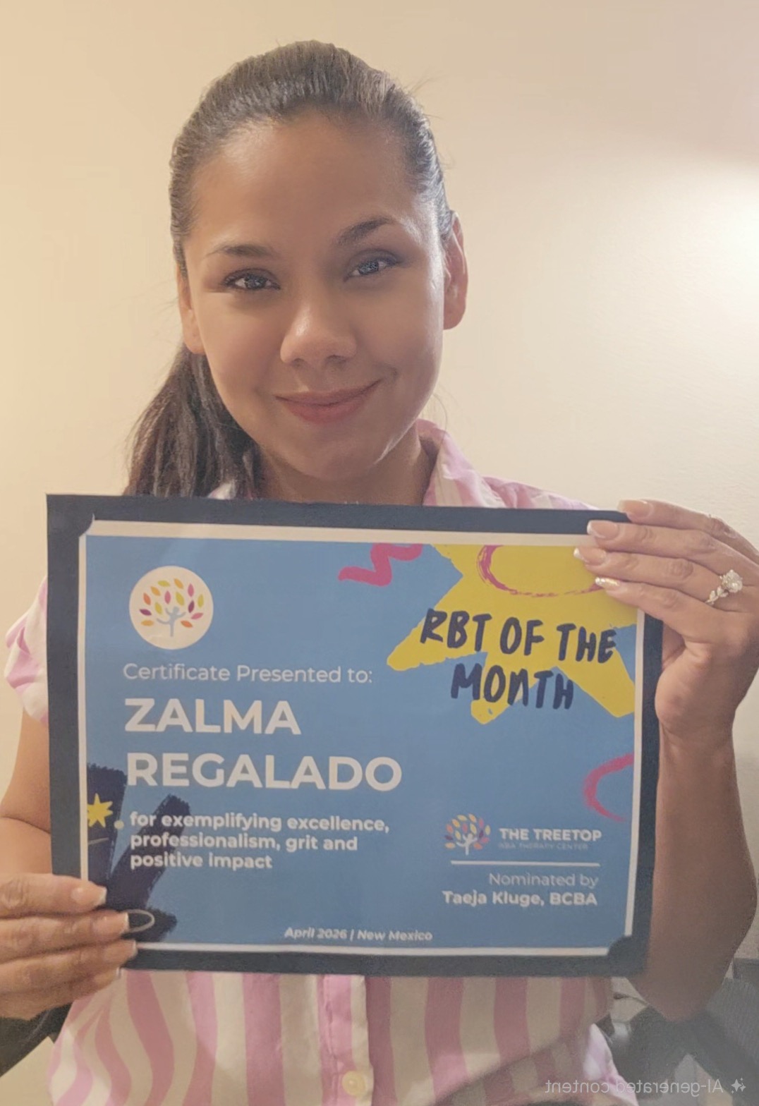 Zalma Regalado holding her BT of the Month certificate