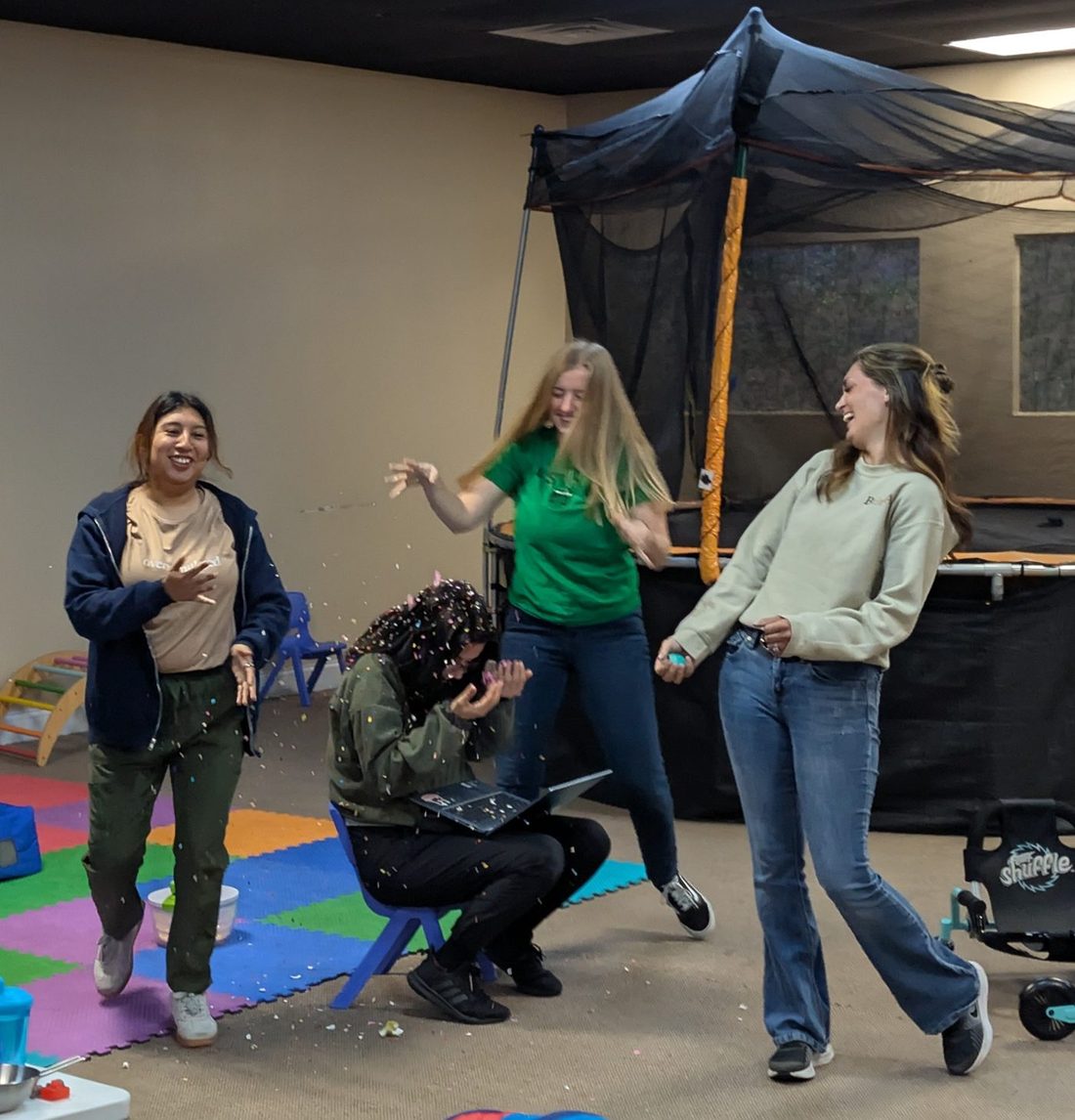 Team cracking confetti eggs at egg hunt