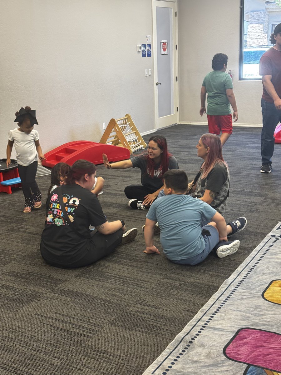 Mesa team and clients playing Duck Duck Goose