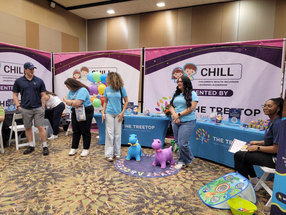 Treetop CHILL Act booth with dinosaur play area