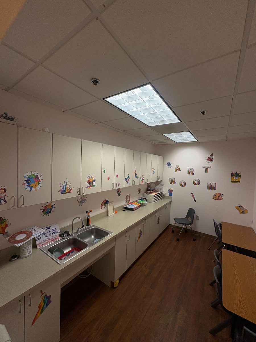 Art room with handprint art on cabinets