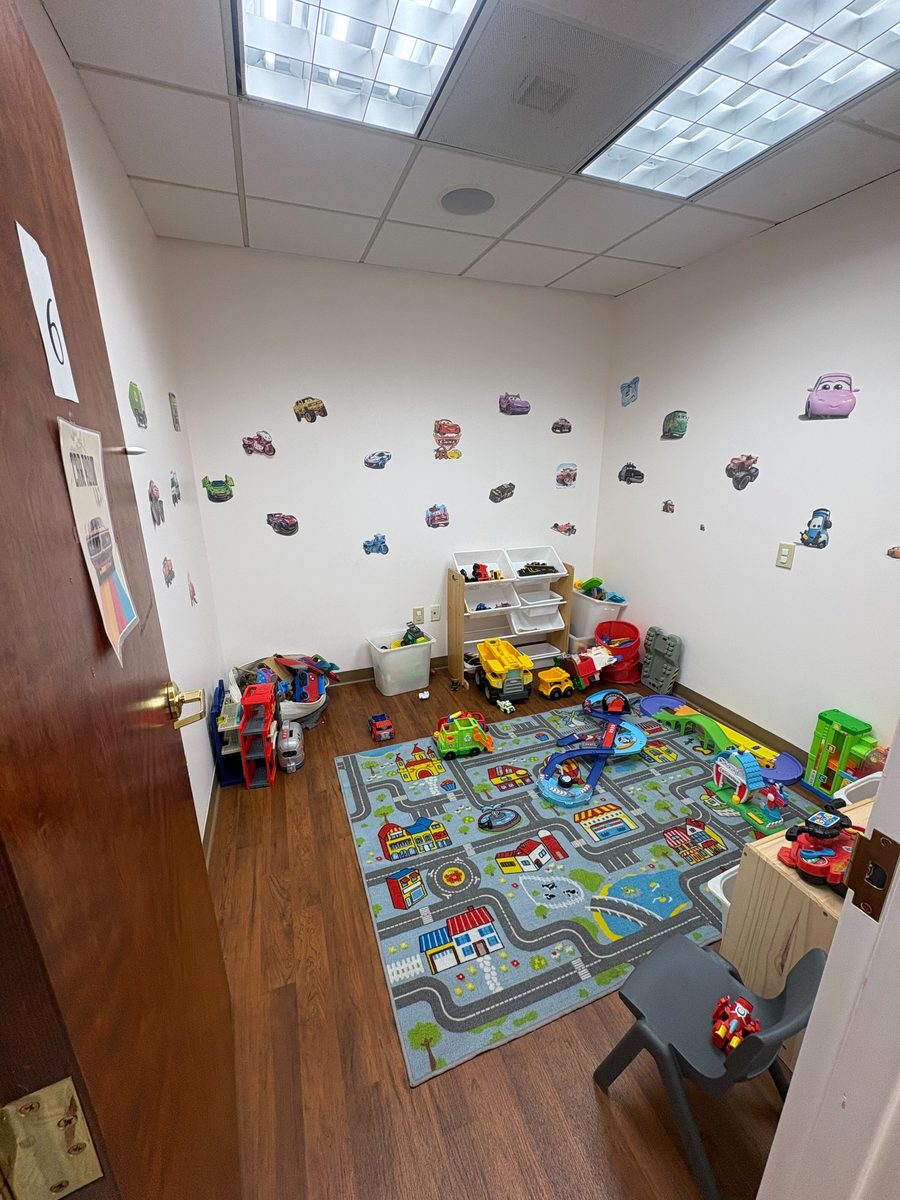 Cars themed playroom with city rug
