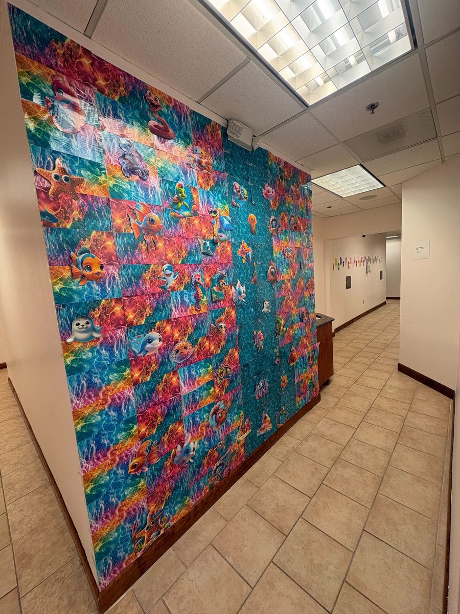 Long colorful sea life mural in clinic hallway