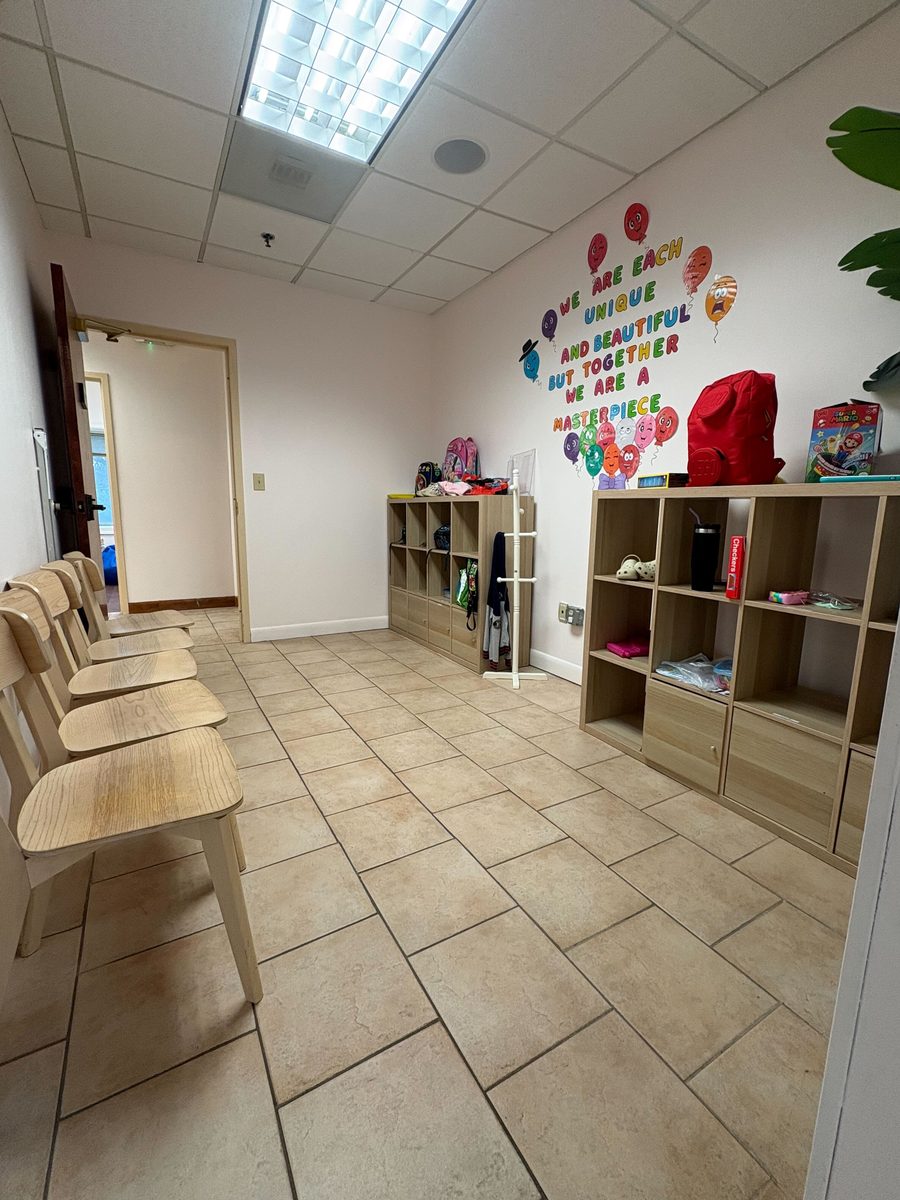 Discovery Therapy waiting area with We are each unique wall art