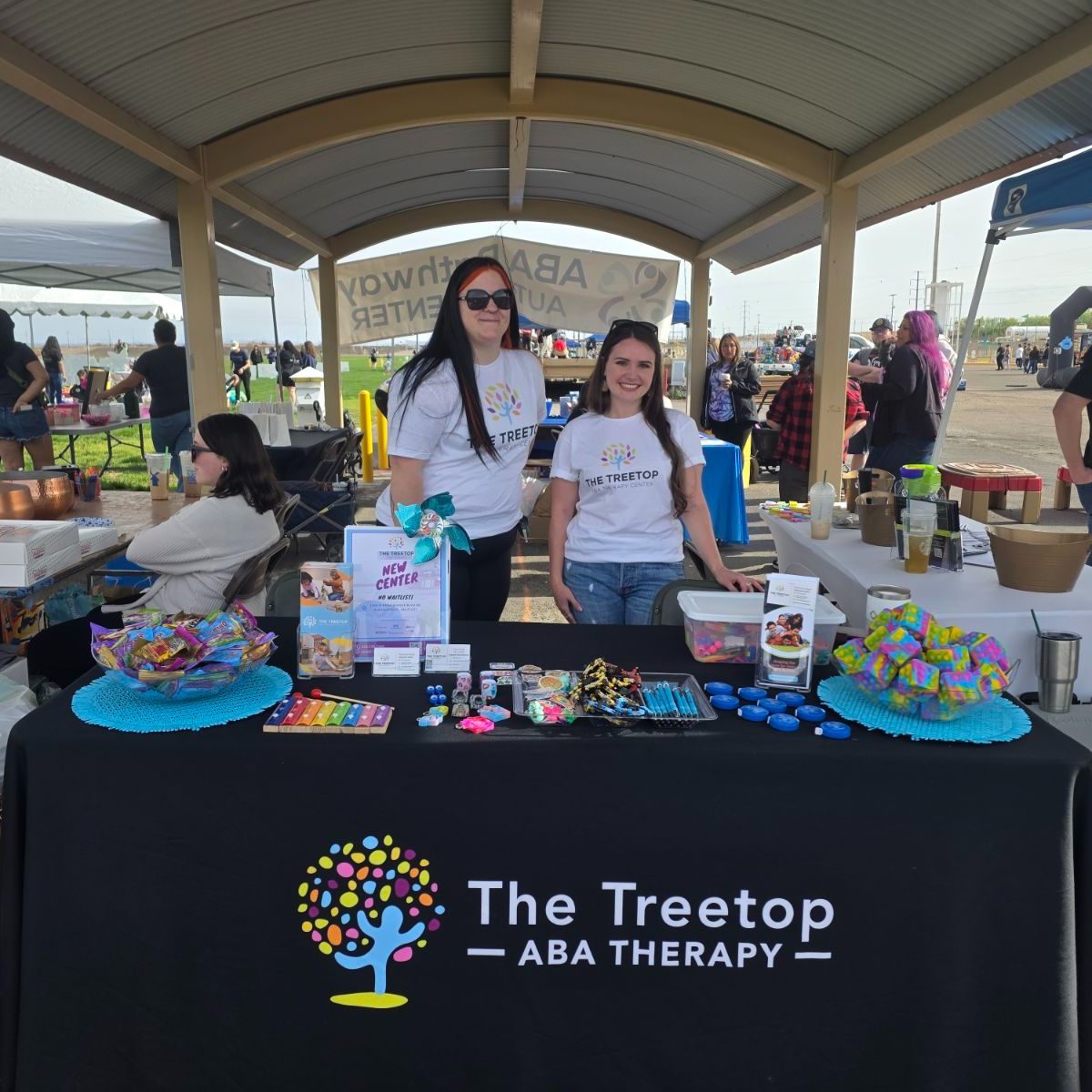 Treetop teammates at the NM community event booth