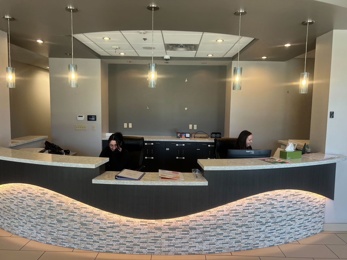 Treetop Scottsdale front desk with two staff members